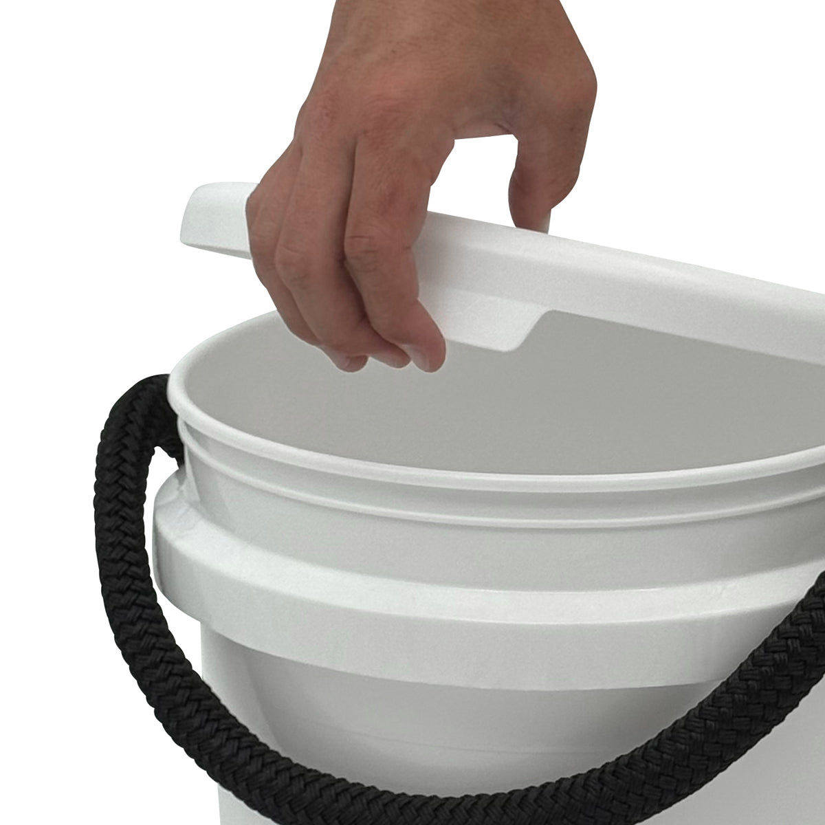 A hand removes the Shurhold Industries, Inc. Bucket Lid from a white plastic bucket with a black rope handle using the ergonomic release tab for easy opening.