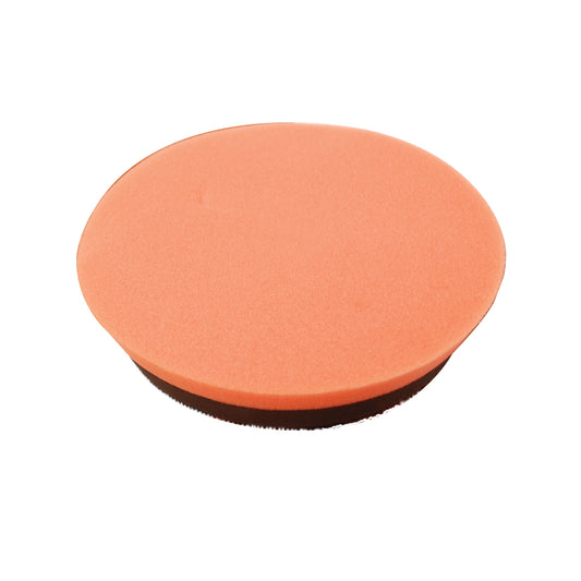 A round, flat, orange Buff Magic Light Oxidation Pad by Shurhold Industries, Inc., with a black base, seen at an angle on a white background—perfect for use with Buff Magic and the Shurhold Dual Action Polisher PRO.