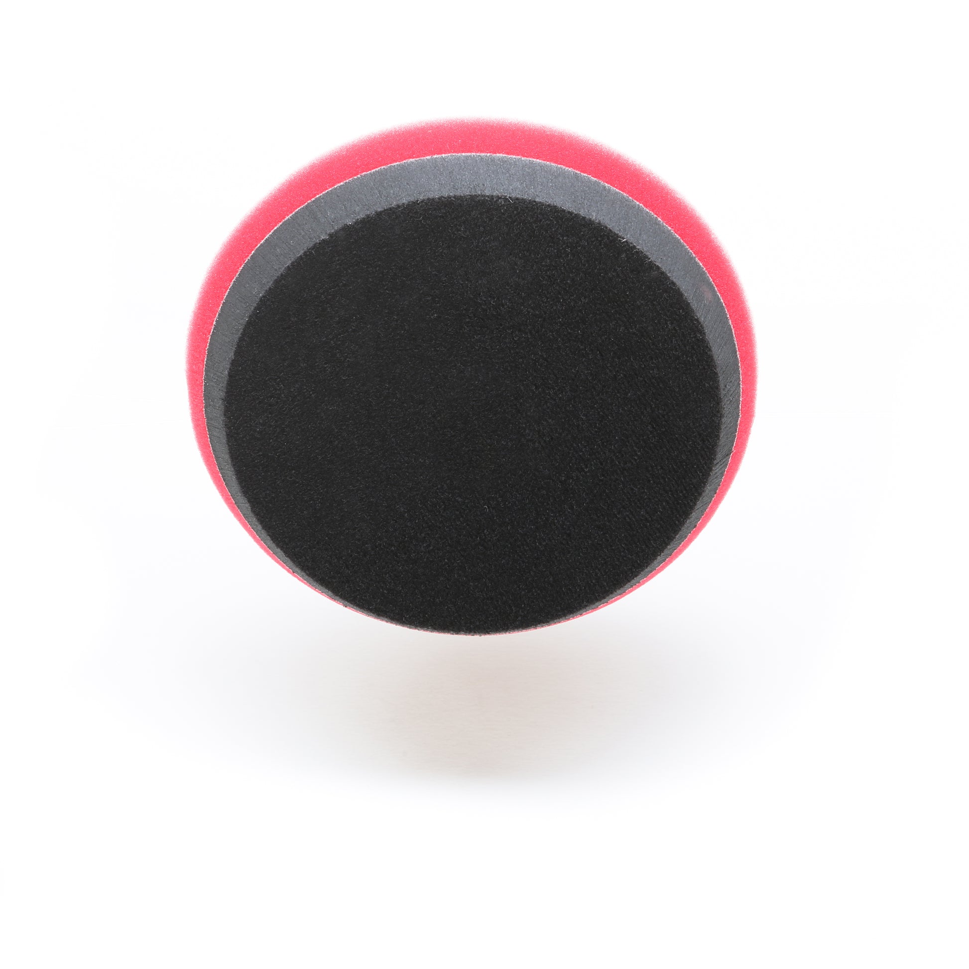 The Shurhold Industries Pro Polish Pad for DAP PRO is a round, black and red 7 foam pad with a gray stripe, designed for polishing and waxing with the Shurhold Dual Action Polisher PRO. Photographed on a white background.