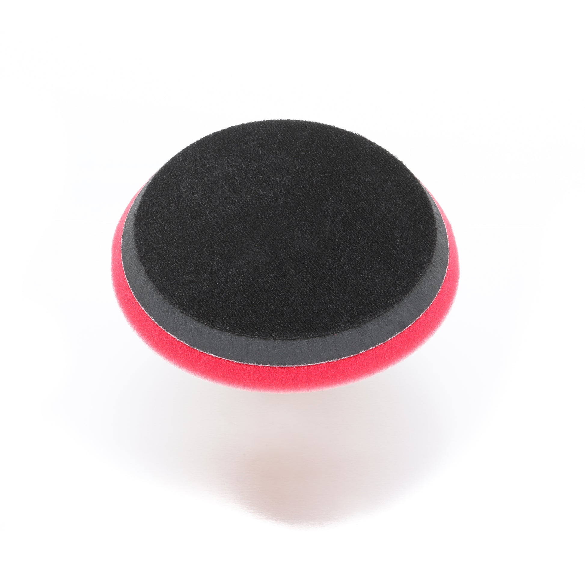 The Pro Polish Pad for DAP PRO by Shurhold Industries, Inc. is a round black and red 7 foam pad for polishing and waxing with the Shurhold Dual Action Polisher PRO, shown on a white background.