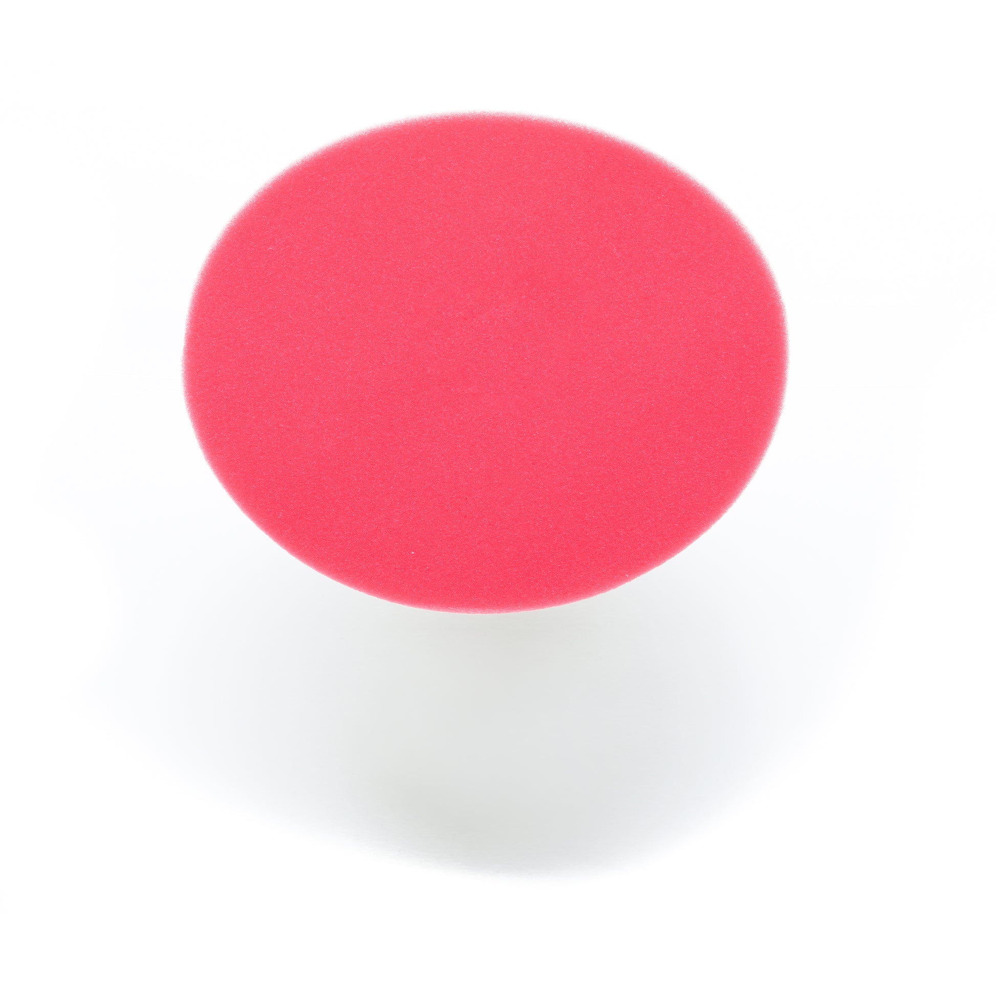 A round, red 7 Pro Polish Pad for DAP PRO by Shurhold Industries, Inc. is shown from above with a soft shadow on white—ideal for polishing and waxing with the Shurhold Dual Action Polisher PRO.