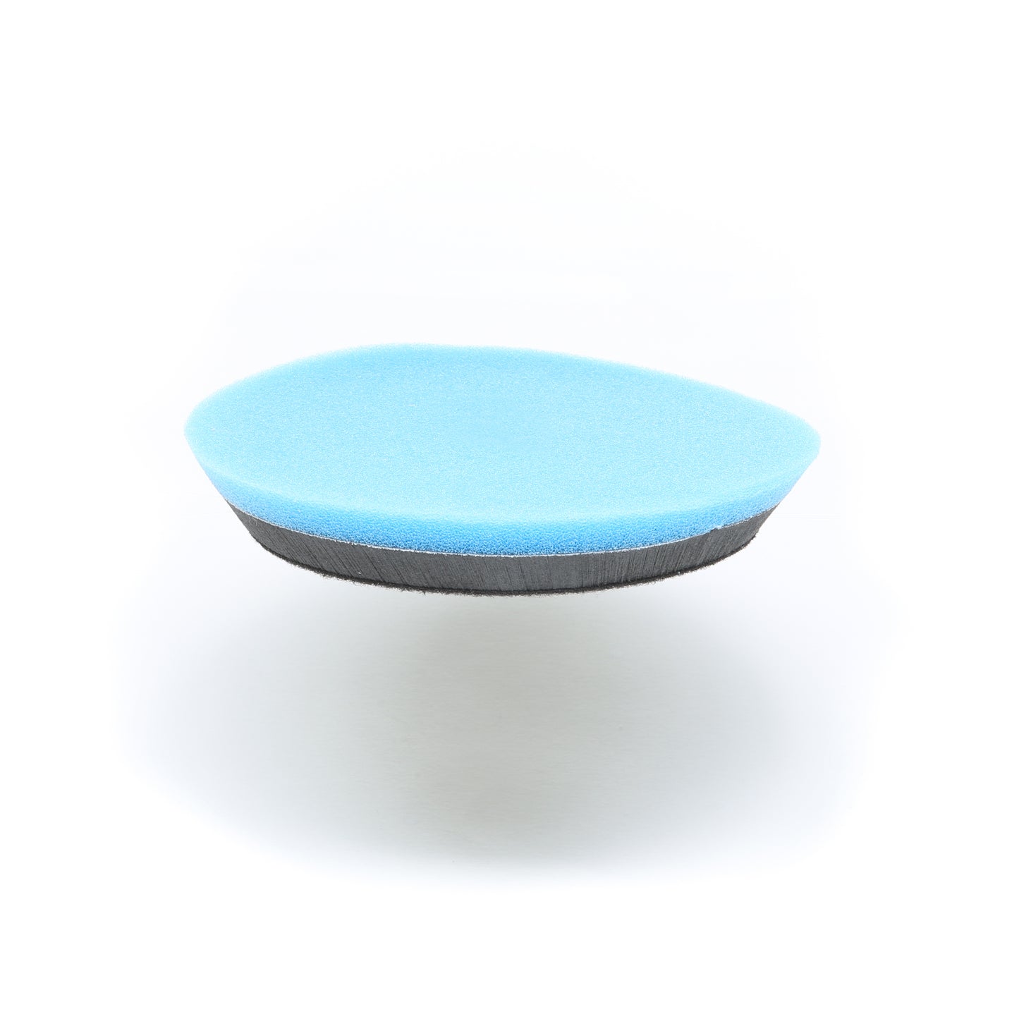 The Shurhold Industries, Inc. Buff Magic Heavy Oxidation Pad, a round blue and black foam sponge for tackling severe oxidation, is displayed on a plain white background.