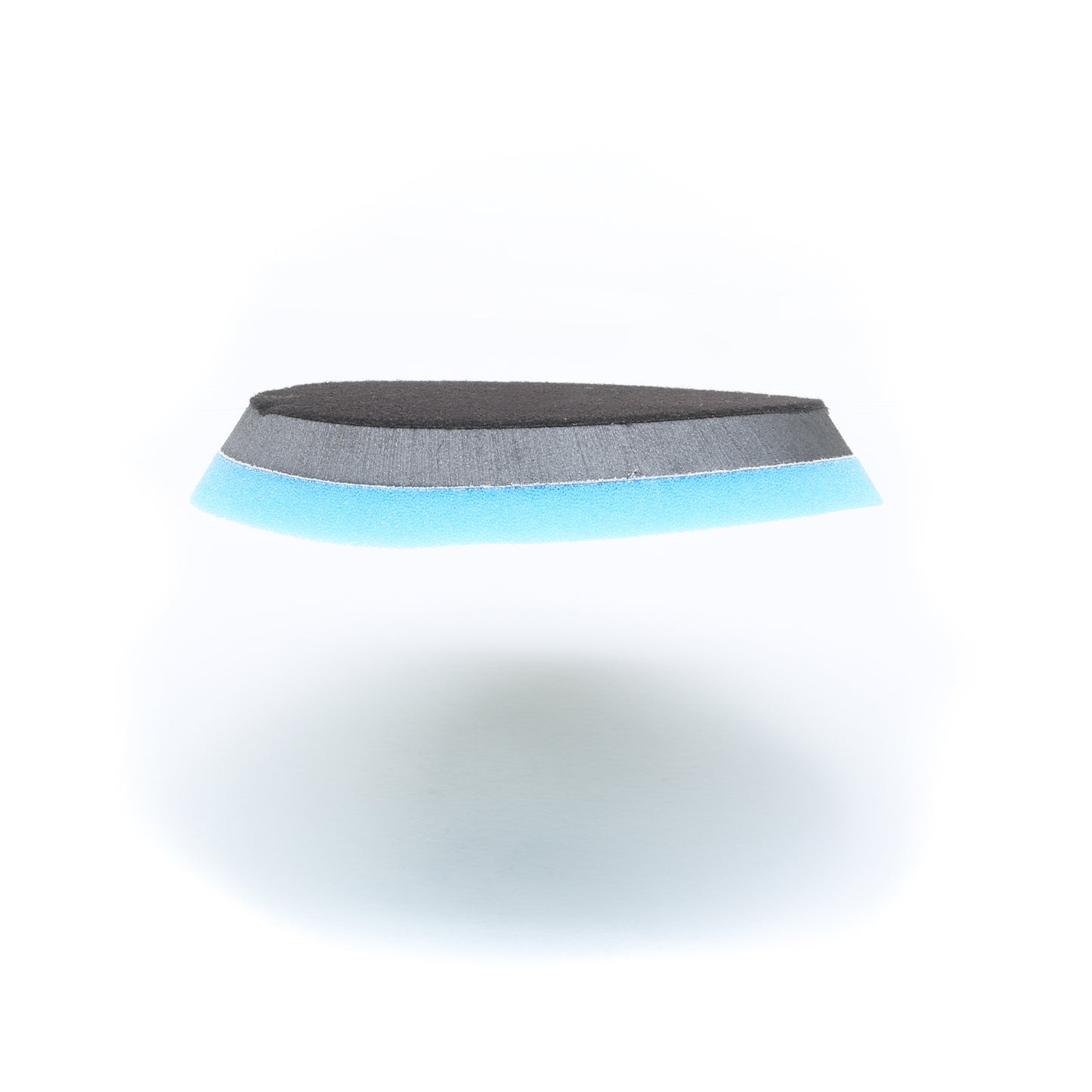 The Buff Magic Heavy Oxidation Pad by Shurhold Industries, Inc., featuring layered black, gray, and blue foam in a wedge shape, is perfect for removing severe oxidation with the Shurhold Dual Action Polisher PRO.