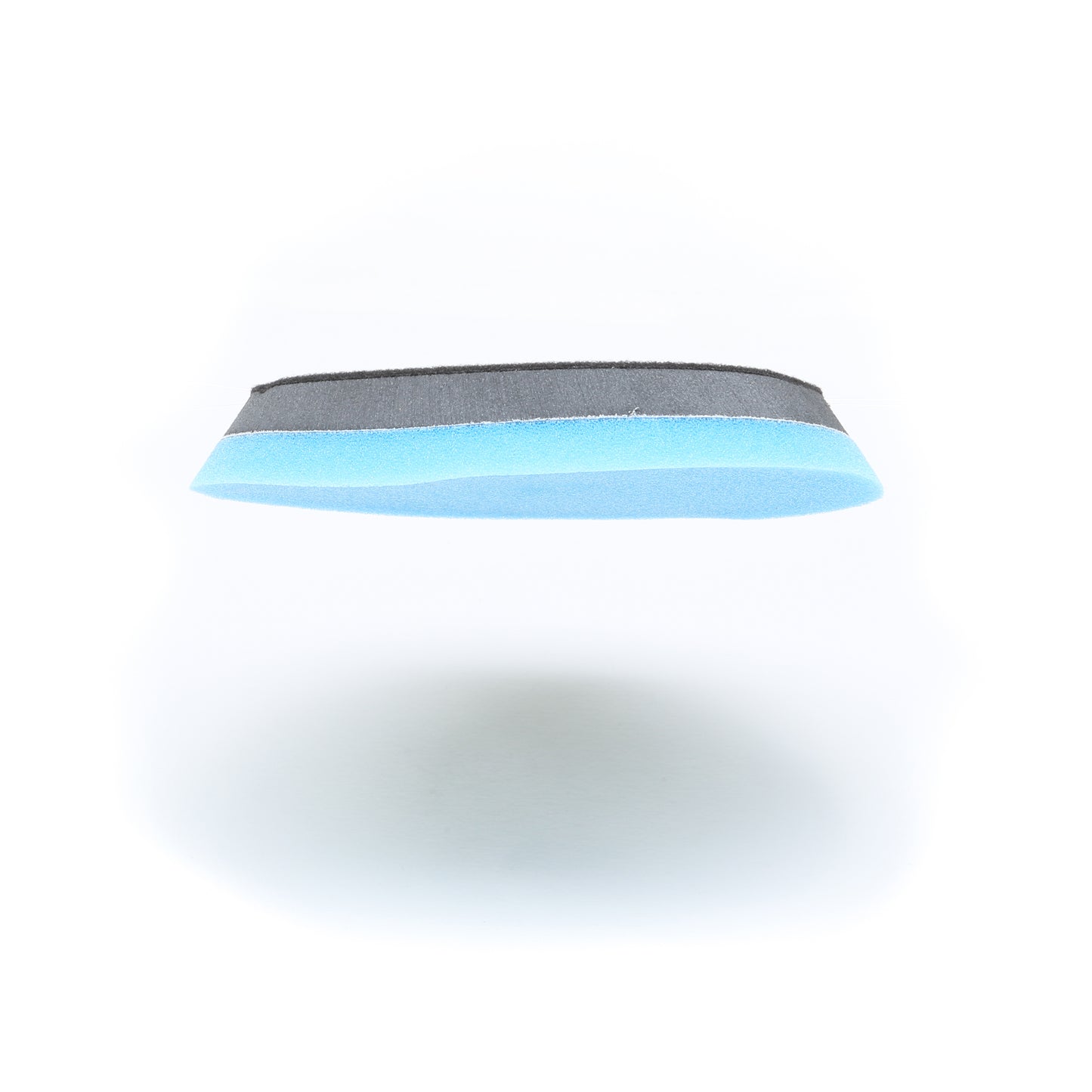 A blue and black Shurhold Industries, Inc. Buff Magic Heavy Oxidation Pad is shown on a white background with a shadow—ideal for tackling severe oxidation when paired with the Shurhold Dual Action Polisher PRO.