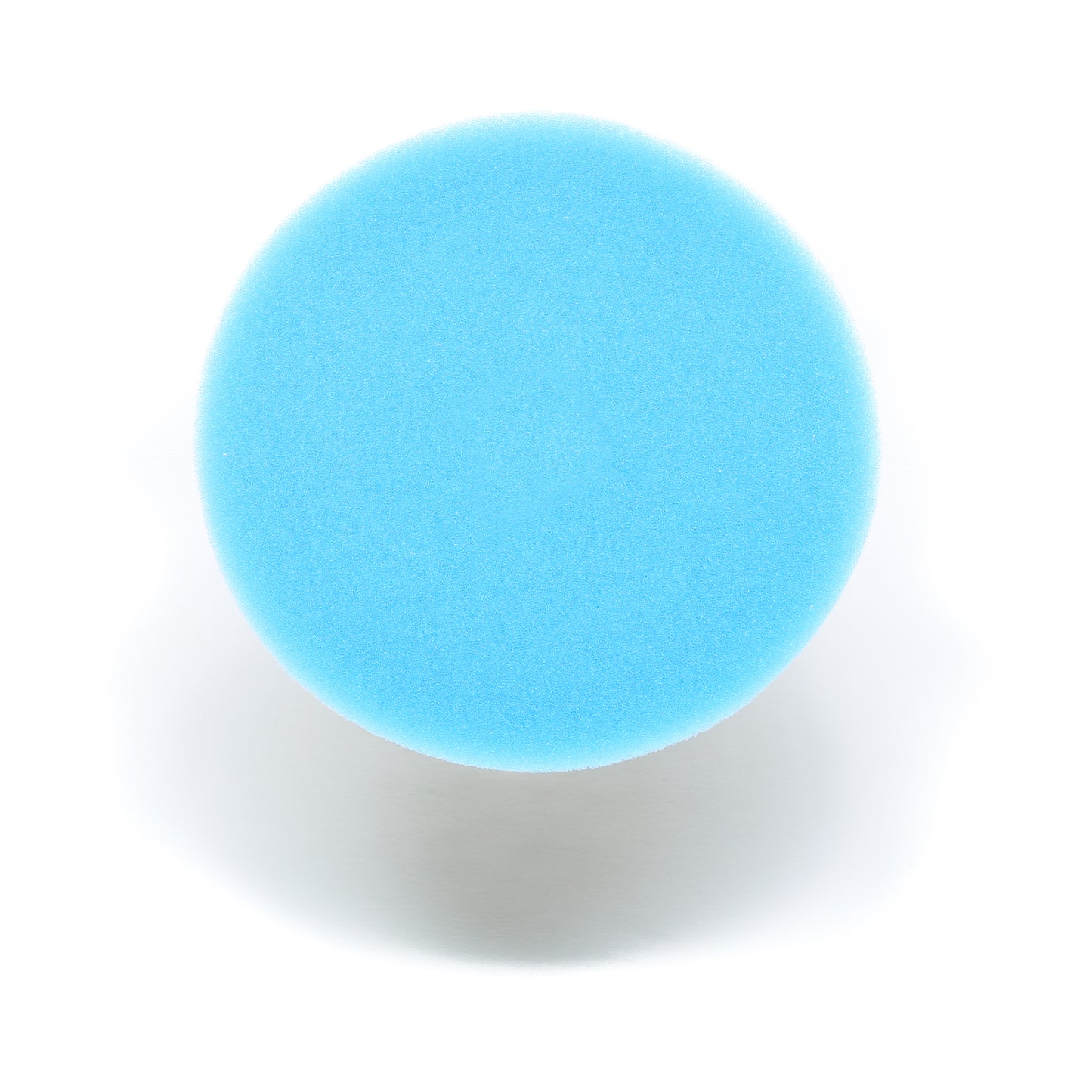 A round blue Buff Magic Heavy Oxidation Pad by Shurhold Industries, Inc. is photographed from above on a white background, faint shadow visible—perfect for tackling severe oxidation with your Shurhold Dual Action Polisher PRO.