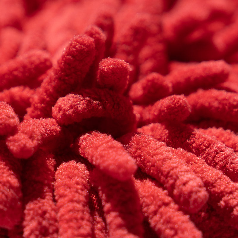 Close-up of red, textured chenille microfiber strands on the Shurhold Industries, Inc. Chenille Microfiber Premium Scratch-Free Wash Mitt, featuring soft, cylindrical fibers for gentle, scratch-free washing.