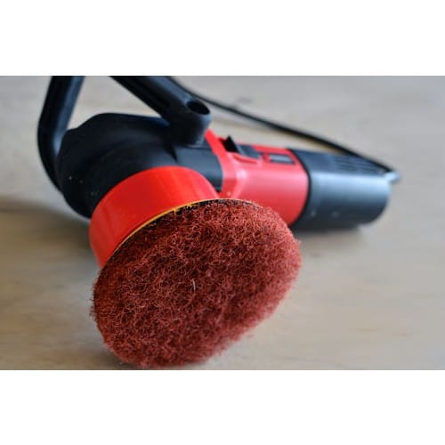 Shurhold DAP Scrubber Pad attached to Dual Action Polisher