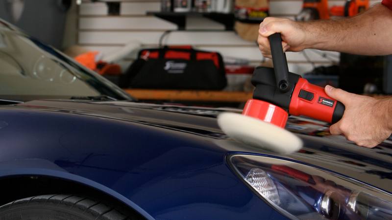 Man Buffing a Car