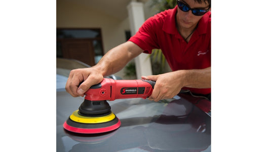 Man waxing with the Shurhold Dual Action Polisher Pro