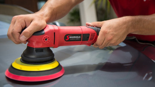 Dual Action Polisher Pro being used to wax a car