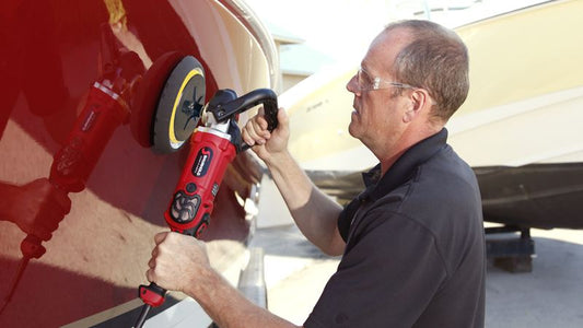 Man Buffing Boat with Polisher