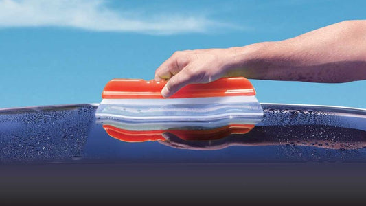 Shurhold Water Blade being used to dry a car.