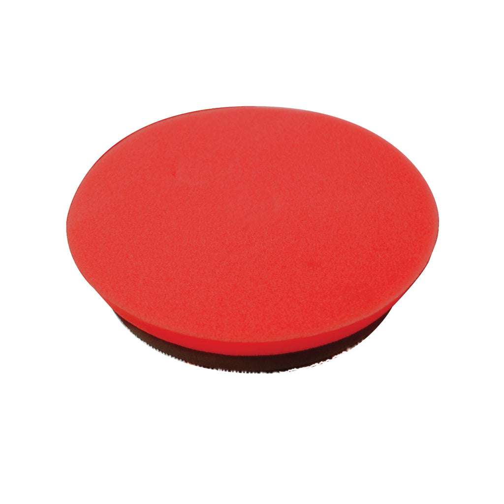 The Pro Polish Pad for DAP PRO by Shurhold Industries, Inc. is a round, flat, red 7 foam pad with a black base, ideal for polishing and waxing with the Shurhold Dual Action Polisher PRO.
