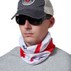 Man wearing white and red bandanna around neck
