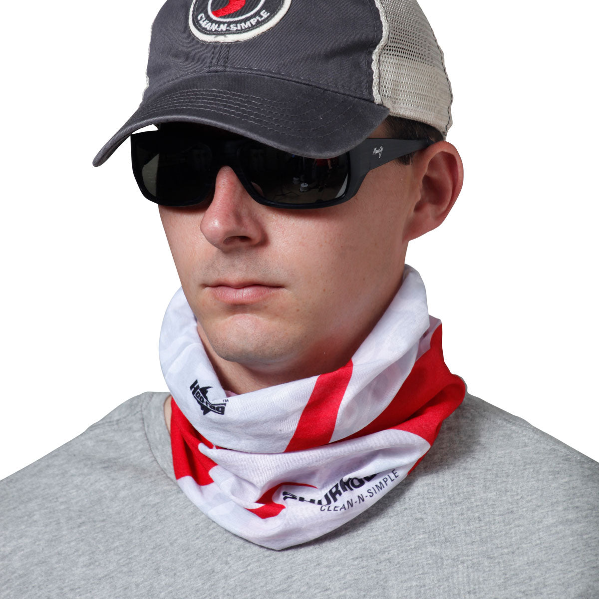 Man wearing white and red bandanna around neck