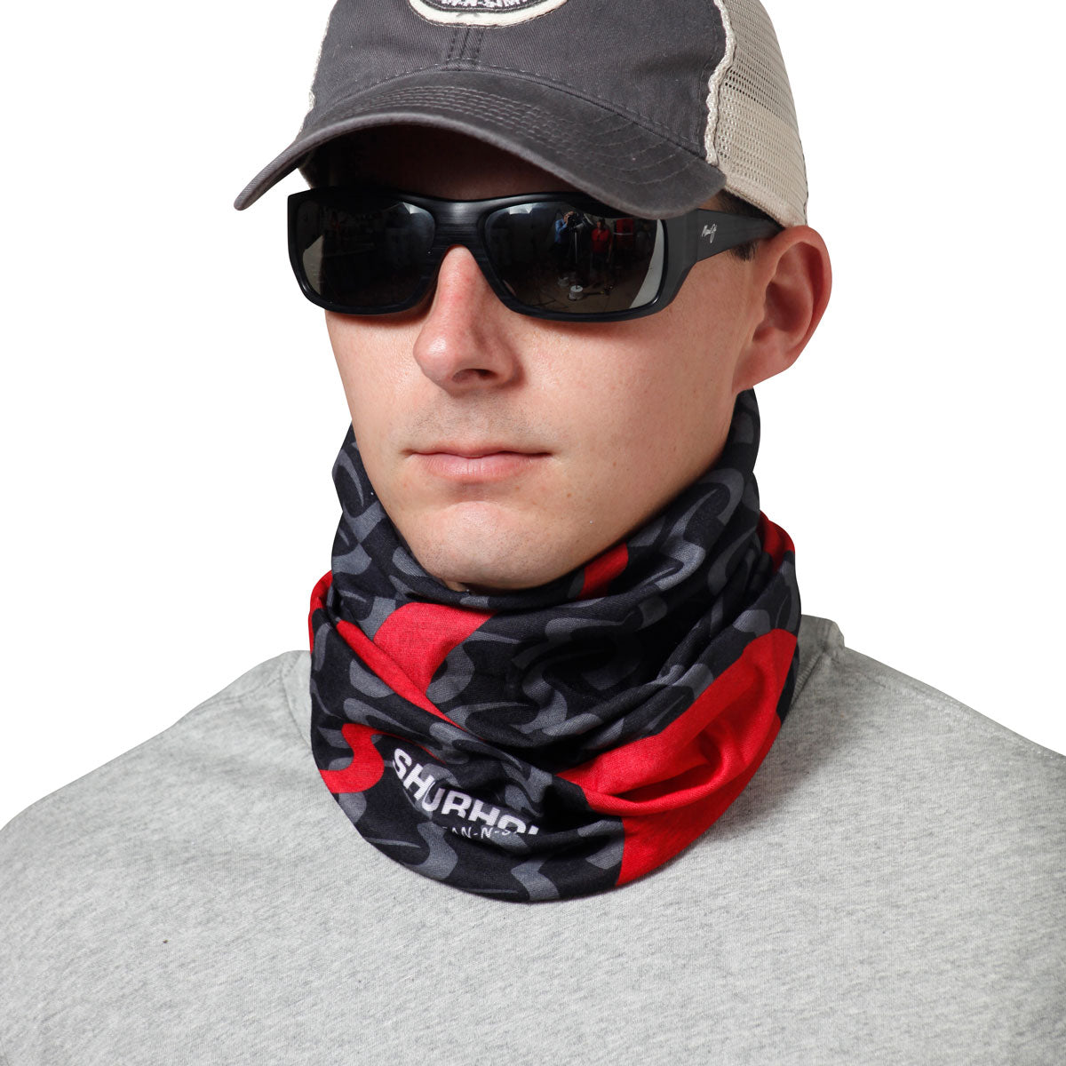 Man wearing black and red bandanna around neck