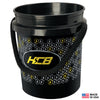 Black plastic bucket with a rope handle, decorated with a hexagonal pattern and yellow KCB logo; Made in USA label and small American flag shown in corner.